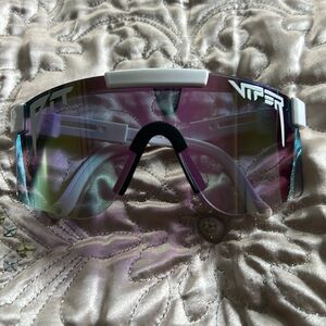 White frame Pit Viper glasses with metallic look pale purple/green lens.